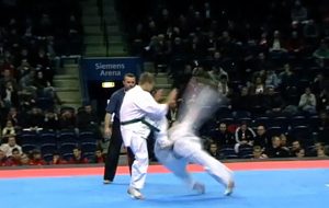 Kyokushin Katas - Picture of a Kyokushin wheel kick being used during a sparring competition